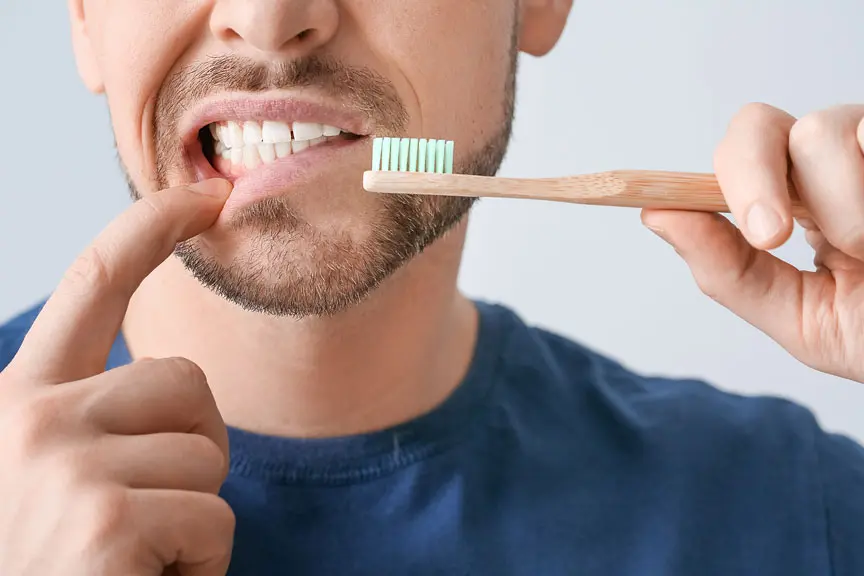 Man Pointing at His Gums