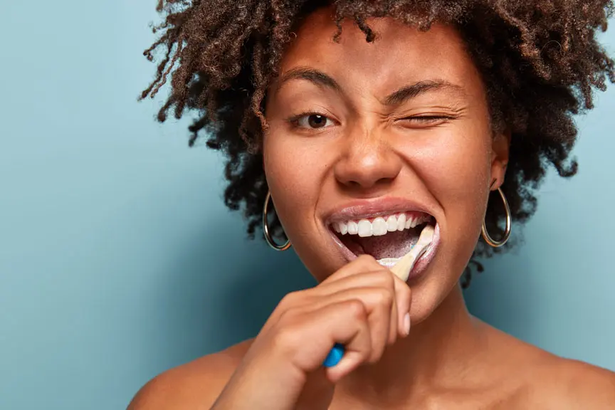 Woman Brushing Teeth