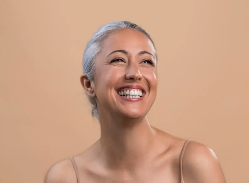 Woman Smiling Post Dental Implants In Richmond, MI