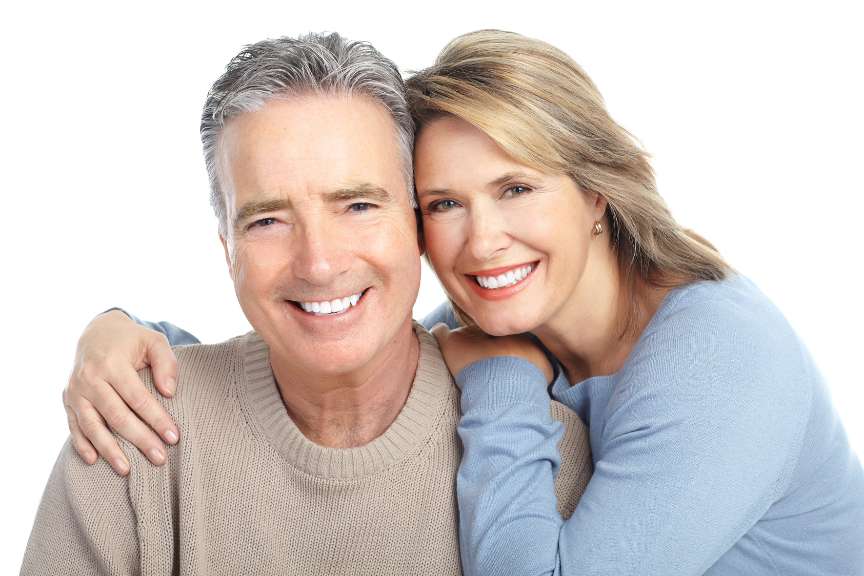 Smiling Couple After Dental Implant Procedure