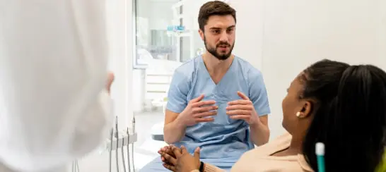 Dentist Discussing Treatment With Patient