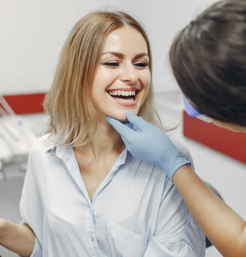 Dentist Examining Patient's Smile
