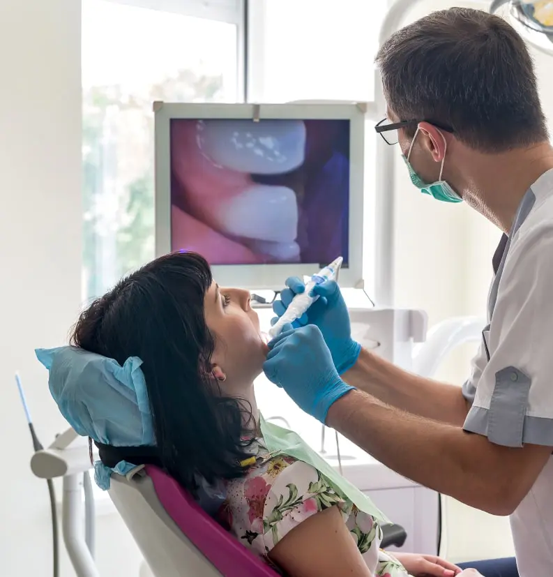Dentist Performing Procedure With Intraoral Camera