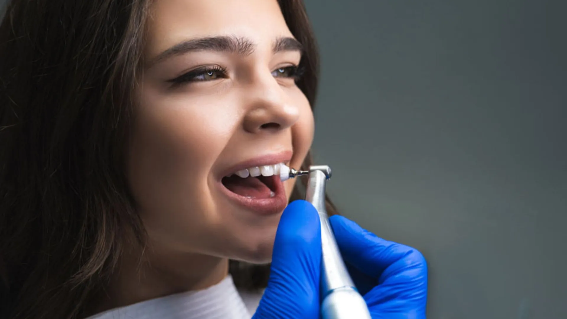 Woman Having Teeth Polished by Dentist